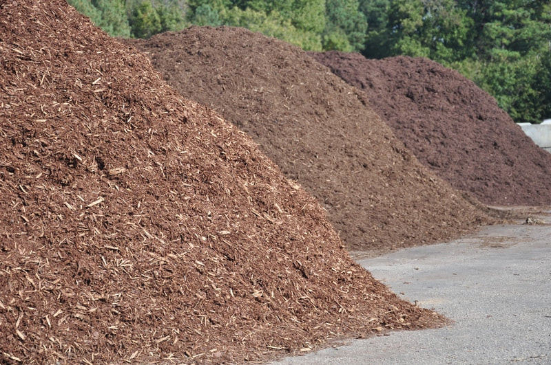 3 piles of brown mulch